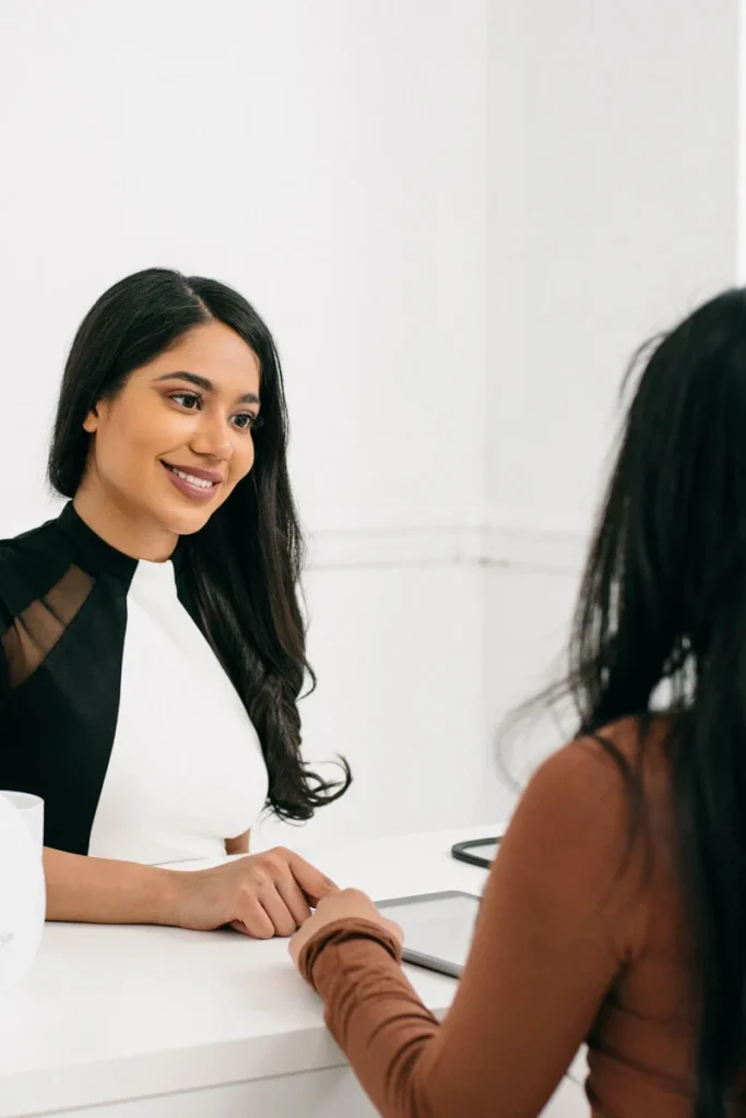 Nurse Shazmeen Damji consults with client.