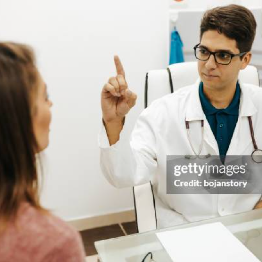 Aesthetic nurse consults with client.