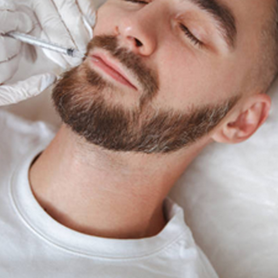 Aesthetic nurse injects their client's upper lip.