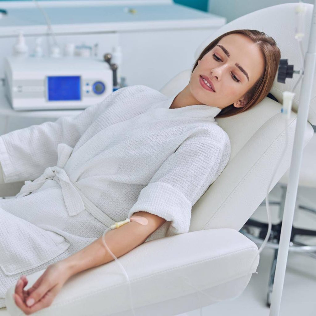 Woman receives IV drip.