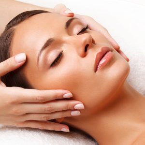 Woman receives a facial.